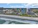 Scenic aerial view of the coastline with buildings, hotels, and sandy beach with ocean waves, offering a coastal lifestyle at 211 76Th Ave. N # A-2, Myrtle Beach, SC 29572