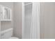 Bathroom featuring shower with white tile and a modern toilet at 211 76Th Ave. N # A-2, Myrtle Beach, SC 29572