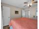 Bright bedroom with a comfortable bed, ceiling fan and closet space for optimal storage at 211 76Th Ave. N # A-2, Myrtle Beach, SC 29572