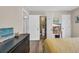 Neutral bedroom with en-suite bathroom and stylish dark wood furnishings and warm yellow comforter at 211 76Th Ave. N # A-2, Myrtle Beach, SC 29572