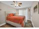 Inviting bedroom with warm colors, a plush bed, and natural light from the sliding glass door at 211 76Th Ave. N # A-2, Myrtle Beach, SC 29572