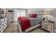 Cozy bedroom featuring coastal-themed decor, a comfortable bed with striped linens, and natural light at 211 76Th Ave. N # A-2, Myrtle Beach, SC 29572