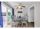 Bright dining area featuring glass-top table, wicker chairs, and sliders to the balcony at 211 76Th Ave. N # A-2, Myrtle Beach, SC 29572