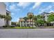 Street view of the condo community with balconies and palm trees at 211 76Th Ave. N # A-2, Myrtle Beach, SC 29572