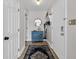 Hallway with beachy decor, a blue accent cabinet, and a mirror that enhances the spacious feel at 211 76Th Ave. N # A-2, Myrtle Beach, SC 29572
