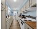 Galley kitchen with sleek countertops, traditional appliances and a view of the breakfast nook at 211 76Th Ave. N # A-2, Myrtle Beach, SC 29572