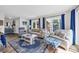 Living room featuring blue accents, comfortable seating, and bright natural light at 211 76Th Ave. N # A-2, Myrtle Beach, SC 29572
