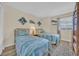 Bright bedroom features two twin beds with nautical bedding and beachy decor at 2507 S Ocean Blvd. # 802, North Myrtle Beach, SC 29582