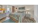 Bright bedroom featuring balcony access, coastal decor and artwork at 2507 S Ocean Blvd. # 802, North Myrtle Beach, SC 29582