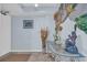 Entryway with blue walls, beach themed decor, a glass table, and tile floor at 2507 S Ocean Blvd. # 802, North Myrtle Beach, SC 29582