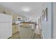 Bright kitchen featuring granite counters, an island, and an open concept living space at 2507 S Ocean Blvd. # 802, North Myrtle Beach, SC 29582