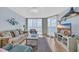 Bright living room with ocean views and balcony access at 2507 S Ocean Blvd. # 802, North Myrtle Beach, SC 29582