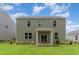 The backyard includes a covered porch and furniture that offers an inviting space for relaxation at 2639 Riverboat Way, Conway, SC 29526