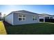 A well-maintained backyard with an extended covered patio and a view of neighboring homes at 2820 Riverboat Way, Conway, SC 29526