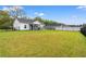 Expansive backyard showcases a well-maintained lawn and a charming, screened-in porch at 2827 Allen Dew Rd., Conway, SC 29527