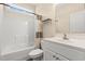 Bright bathroom featuring a shower-tub combo, white vanity, and neutral-toned walls at 2827 Allen Dew Rd., Conway, SC 29527