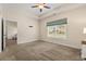 Neutral bedroom with a window view, carpet, ceiling fan and doorways to ensuite and closet at 2827 Allen Dew Rd., Conway, SC 29527