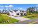 Exterior view of a charming home with a long driveway and a well-manicured lawn at 2827 Allen Dew Rd., Conway, SC 29527