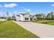 Exterior view of a charming home with a long driveway and a well-manicured lawn at 2827 Allen Dew Rd., Conway, SC 29527