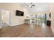 Spacious living area featuring a tv and open floor plan flowing into the dining area and kitchen at 2827 Allen Dew Rd., Conway, SC 29527