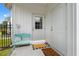 Cozy porch featuring a decorative door, a small bench and welcome mats at 2827 Allen Dew Rd., Conway, SC 29527