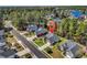 Aerial view of a charming home in a wooded neighborhood with a pond nearby at 3148 Bayhaven Dr., Myrtle Beach, SC 29579