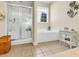 Bathroom featuring a glass-enclosed shower, soaking tub, and decorative accents at 3148 Bayhaven Dr., Myrtle Beach, SC 29579