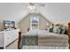Bedroom with a tv, window with blinds, and a bed with decorative bedding at 3148 Bayhaven Dr., Myrtle Beach, SC 29579