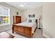 Comfortable bedroom with a wooden sleigh bed, classic armoire, and neutral décor at 3148 Bayhaven Dr., Myrtle Beach, SC 29579