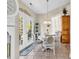 Cozy dining area featuring a white table and chairs with nearby french doors at 3148 Bayhaven Dr., Myrtle Beach, SC 29579