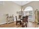 Elegant dining room with a chandelier, arched window, and decorative accents at 3148 Bayhaven Dr., Myrtle Beach, SC 29579