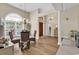 Bright dining room with chandelier lighting, wood floors, and a large arched window with lots of natural light at 3148 Bayhaven Dr., Myrtle Beach, SC 29579