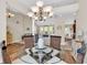 Bright dining area with glass-top table, wicker chairs, and views into living spaces at 3148 Bayhaven Dr., Myrtle Beach, SC 29579