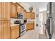 Kitchen featuring tile floors, stainless steel appliances, and lots of wooden cabinets at 3148 Bayhaven Dr., Myrtle Beach, SC 29579