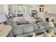Comfortable living room showcasing plentiful natural light, fireplace, and stylish, plush furnishings at 3148 Bayhaven Dr., Myrtle Beach, SC 29579