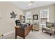 Bright office space boasts a ceiling fan, ample natural light, and comfortable seating at 3148 Bayhaven Dr., Myrtle Beach, SC 29579