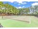 Well-maintained tennis courts surrounded by trees, providing a serene playing environment at 3148 Bayhaven Dr., Myrtle Beach, SC 29579