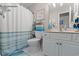 Coastal themed bathroom featuring a shower/tub combo and vanity with cabinet storage at 323 14Th Ave. S # B, Surfside Beach, SC 29575