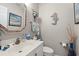 Powder room with white sink, vanity, and decorative elements, and seahorse decoration at 323 14Th Ave. S # B, Surfside Beach, SC 29575