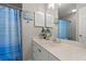 Bathroom featuring a white vanity, a framed mirror, and a combination shower and bathtub at 323 14Th Ave. S # B, Surfside Beach, SC 29575