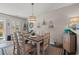 Comfortable dining room with an elegant light fixture and space for six at 323 14Th Ave. S # B, Surfside Beach, SC 29575