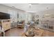 Bright living room with ceiling fan, wicker accents and large windows at 323 14Th Ave. S # B, Surfside Beach, SC 29575