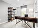 Well-lit home office featuring a modern desk, stylish shelving, and a comfortable workspace at 319 Myrtle Meadows Dr # 401D, Conway, SC 29526