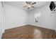 Bright bedroom features hardwood flooring, ceiling fan, and window at 3851 Journeys End Rd., Murrells Inlet, SC 29576