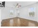 Bright bedroom featuring hardwood floors, neutral paint, lots of natural light and a ceiling fan at 3851 Journeys End Rd., Murrells Inlet, SC 29576