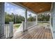 Inviting covered porch with wood flooring and ceiling, featuring a scenic neighborhood view at 3851 Journeys End Rd., Murrells Inlet, SC 29576