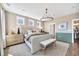 This bright main bedroom features great natural lighting, modern furniture, and decor at 393 Sun Colony Blvd., Longs, SC 29568