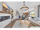 Bright living room showcasing fireplace, stairway, open floor plan, and modern design at 393 Sun Colony Blvd., Longs, SC 29568