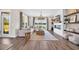 Inviting living room featuring modern furniture, fireplace, lake views, and bright natural light at 393 Sun Colony Blvd., Longs, SC 29568
