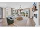 Spacious living room with fireplace, comfortable seating, and a stunning view of the lake at 393 Sun Colony Blvd., Longs, SC 29568